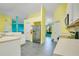 Spacious kitchen with white cabinets, stainless steel appliances, and an open design at 847 Coventry Rd, Davenport, FL 33897
