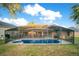 View of the screened-in pool and hot tub area at 847 Coventry Rd, Davenport, FL 33897