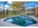 View of the screened-in pool and hot tub area at 847 Coventry Rd, Davenport, FL 33897