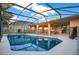 View of the screened-in pool and hot tub area at 847 Coventry Rd, Davenport, FL 33897