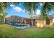 View of the screened-in pool and hot tub area at 847 Coventry Rd, Davenport, FL 33897