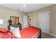 Cozy bedroom with plush bedding and dresser near the bed at 978 Commons Way, Port Orange, FL 32129