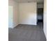 Neutral bedroom with carpet flooring and large windows for lots of natural light at 978 Commons Way, Port Orange, FL 32129