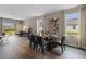 Dining area with modern table, chairs, and plenty of natural light from nearby windows at 978 Commons Way, Port Orange, FL 32129