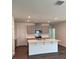 Modern kitchen featuring an island, stainless steel appliances, and stylish cabinetry at 978 Commons Way, Port Orange, FL 32129