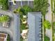 An aerial view displays townhome landscaping and hardscape, including a courtyard and back patios at 984 Fern Ave, Orlando, FL 32814