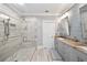 Stylish bathroom with walk-in shower, double sinks, and a granite countertop at 984 Fern Ave, Orlando, FL 32814