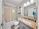 Cozy bathroom with bathtub, shower and granite vanity at 984 Fern Ave, Orlando, FL 32814