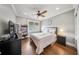 Comfortable bedroom with hardwood floors, ceiling fan, and natural light from the window at 984 Fern Ave, Orlando, FL 32814
