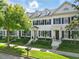 Charming townhome with classic architectural details, manicured front yard, and inviting entryway at 984 Fern Ave, Orlando, FL 32814