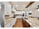 A full view of the large kitchen with stainless steel appliances, and a breakfast bar with seating at 984 Fern Ave, Orlando, FL 32814