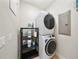 Convenient laundry room featuring a stacked washer and dryer at 984 Fern Ave, Orlando, FL 32814