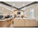 Open-concept living room featuring beamed ceilings, a fireplace, and wood floors at 984 Fern Ave, Orlando, FL 32814