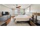 Spacious main bedroom with natural light, ceiling fan, and hardwood floors at 984 Fern Ave, Orlando, FL 32814
