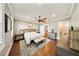 Bright main bedroom features a ceiling fan, hardwood floors, and neutral walls at 984 Fern Ave, Orlando, FL 32814