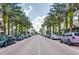 A charming streetscape with palm trees, brick sidewalks, and inviting storefronts, creating a vibrant atmosphere at 984 Fern Ave, Orlando, FL 32814