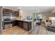 Open-concept living space with modern kitchen and a cozy living area at 989 Commons Way, Port Orange, FL 32129