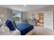 Spacious main bedroom with a scenic view, sophisticated decor, and comfortable furniture at 989 Commons Way, Port Orange, FL 32129