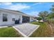Well-maintained backyard showcasing a paved patio area, lush lawn, and manicured landscaping at 16238 Misty Hills Ave, Winter Garden, FL 34787