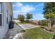 Expansive backyard featuring lush greenery, a paved patio, and privacy landscaping at 16238 Misty Hills Ave, Winter Garden, FL 34787