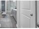 Modern bathroom with double vanity, walk-in shower, and a comfortable bench seating at 16238 Misty Hills Ave, Winter Garden, FL 34787