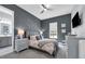 This bedroom offers a calm color palette, ceiling fan, a neutral area rug, and an attached bathroom at 16238 Misty Hills Ave, Winter Garden, FL 34787