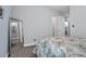 Tastefully designed bedroom featuring a full-length mirror and access to the en-suite bathroom at 16238 Misty Hills Ave, Winter Garden, FL 34787