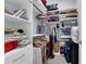 Organized walk-in closet with shelving, hanging rods, and ample storage solutions at 16238 Misty Hills Ave, Winter Garden, FL 34787
