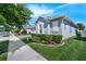 Eye-catching single-story home with lush landscaping, trimmed bushes, and a well-manicured green lawn at 16238 Misty Hills Ave, Winter Garden, FL 34787