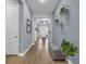 Beautiful hallway with decor, hardwood floors, and a view of the bright, airy interior at 16238 Misty Hills Ave, Winter Garden, FL 34787