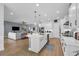 Open kitchen with quartz island and modern appliances is perfect for entertaining and Gathering gatherings at 16238 Misty Hills Ave, Winter Garden, FL 34787