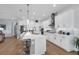 Kitchen featuring stainless steel appliances, modern cabinetry, and an expansive island with seating at 16238 Misty Hills Ave, Winter Garden, FL 34787