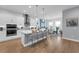 Stunning kitchen with island seating, state-of-the-art appliances, and seamless access to the dining area at 16238 Misty Hills Ave, Winter Garden, FL 34787