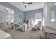 Office with neutral walls, carpet flooring, white desk, and shelves at 16238 Misty Hills Ave, Winter Garden, FL 34787