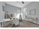 Office with neutral walls, carpet flooring, white desk, and shelves at 16238 Misty Hills Ave, Winter Garden, FL 34787