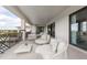 Inviting balcony with golf course views and comfortable seating arrangements at 1014 Jack Nicklaus Ct, Reunion, FL 34747