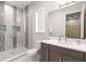 Stylish bathroom with a glass shower, modern vanity, and tile accents at 1014 Jack Nicklaus Ct, Reunion, FL 34747