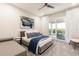 Bright bedroom with a plush king bed, outdoor access and modern decor at 1014 Jack Nicklaus Ct, Reunion, FL 34747
