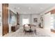 Elegant dining room with a large table, modern decor, and abundant natural light at 1014 Jack Nicklaus Ct, Reunion, FL 34747
