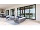 Outdoor patio area with comfortable seating and large sliding glass doors at 1014 Jack Nicklaus Ct, Reunion, FL 34747