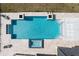 Aerial view of modern pool with spa, tanning ledge, and outdoor lounging at 1014 Jack Nicklaus Ct, Reunion, FL 34747