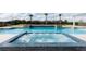 Inviting spa with blue tile accents and tranquil pool views at 1014 Jack Nicklaus Ct, Reunion, FL 34747