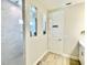 Luxurious bathroom with tiled shower, niche shelving, and decorative accents at 10275 Park Estates Ave, Orlando, FL 32836