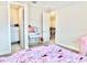 View of a bedroom with open closet, desk, and decor at 10275 Park Estates Ave, Orlando, FL 32836