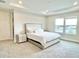 Light and bright bedroom with large bed, tray ceiling, and views from the double windows at 10275 Park Estates Ave, Orlando, FL 32836