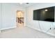 Upstairs bonus room perfect for entertainment, featuring a large television at 10275 Park Estates Ave, Orlando, FL 32836