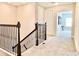 Spacious upstairs hallway with access to bedrooms and views of a Gathering room at 10275 Park Estates Ave, Orlando, FL 32836