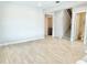 Open hallway view to carpeted stairs and bathroom with tile flooring at 10275 Park Estates Ave, Orlando, FL 32836