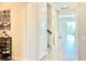 Entryway showcasing wood-look flooring leading to the living area and a view of the dining room at 10275 Park Estates Ave, Orlando, FL 32836