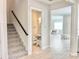 Hallway showcases stairs, access to a bathroom, and a dining area at 10275 Park Estates Ave, Orlando, FL 32836